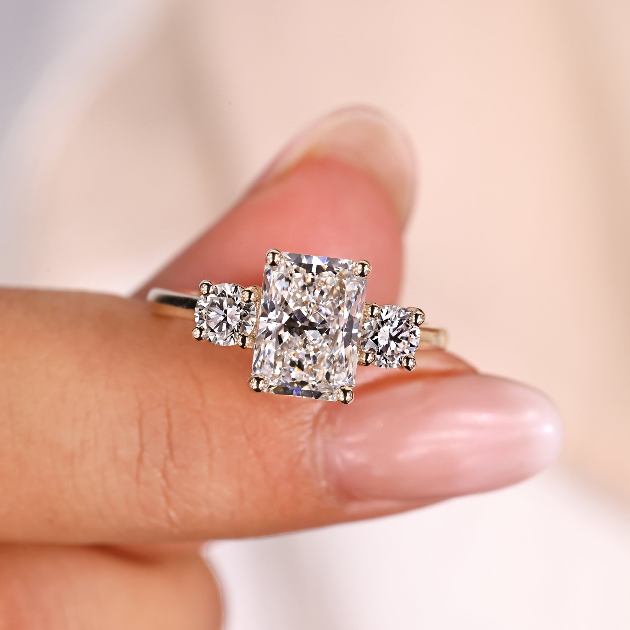 3 stone ring with radiant brilliance and unique design

