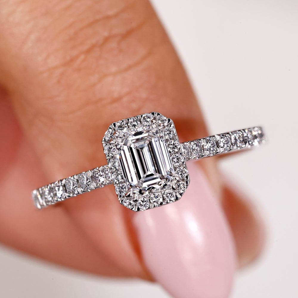 White gold and diamond ring featuring a claw prong.
