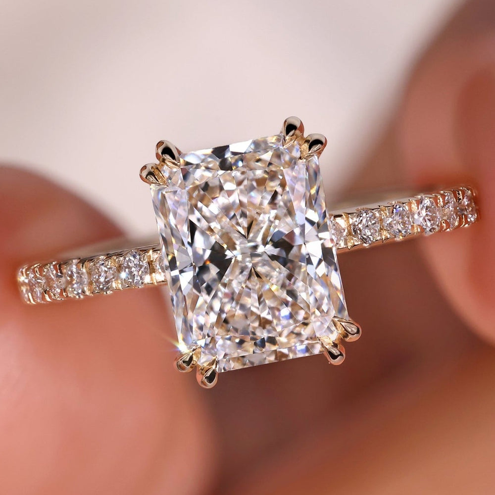 Radiant diamond ring featuring a stunning double prong engagement design.
