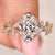 Fairy engagement ring with oval center diamond and side stones
