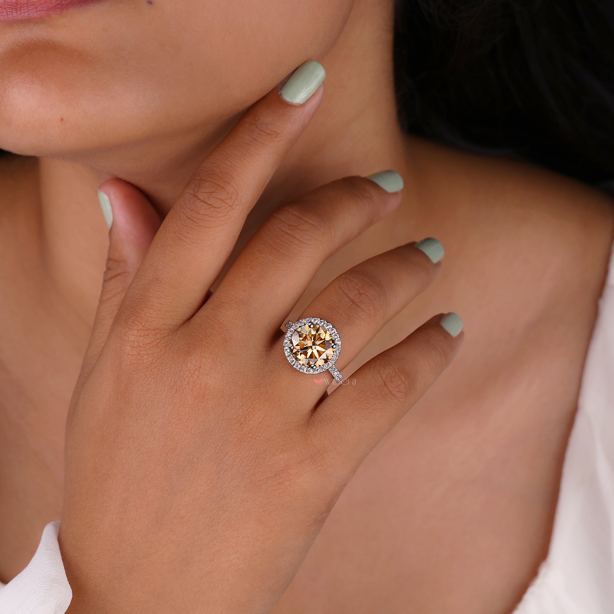 White gold engagement ring with a 4 prong setting.
