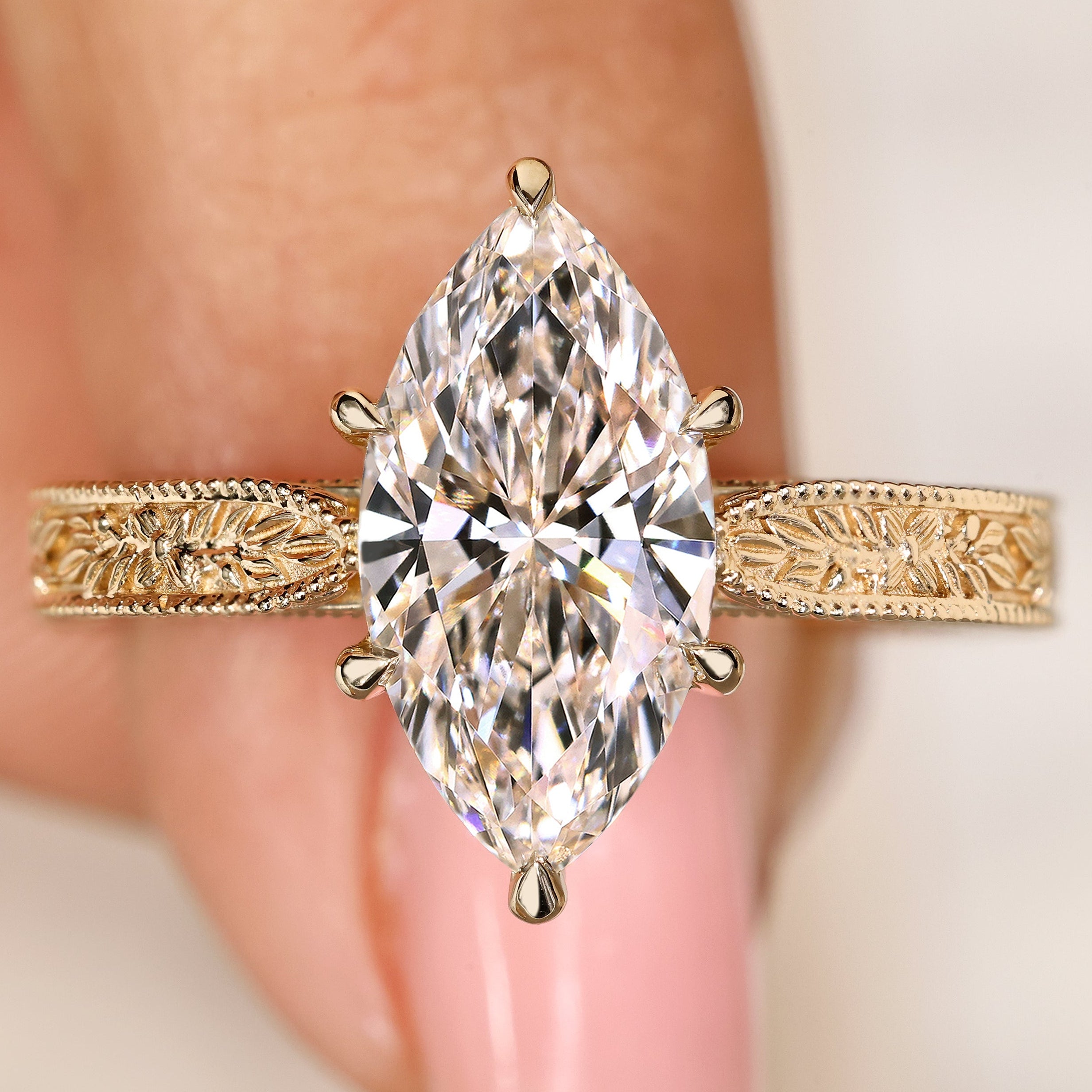 Marquise center lab grown diamond ring with filigree engraving
