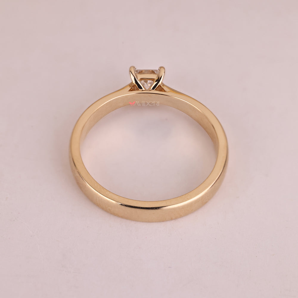 Yellow gold engagement ring with a princess diamond, a practical and stunning choice.