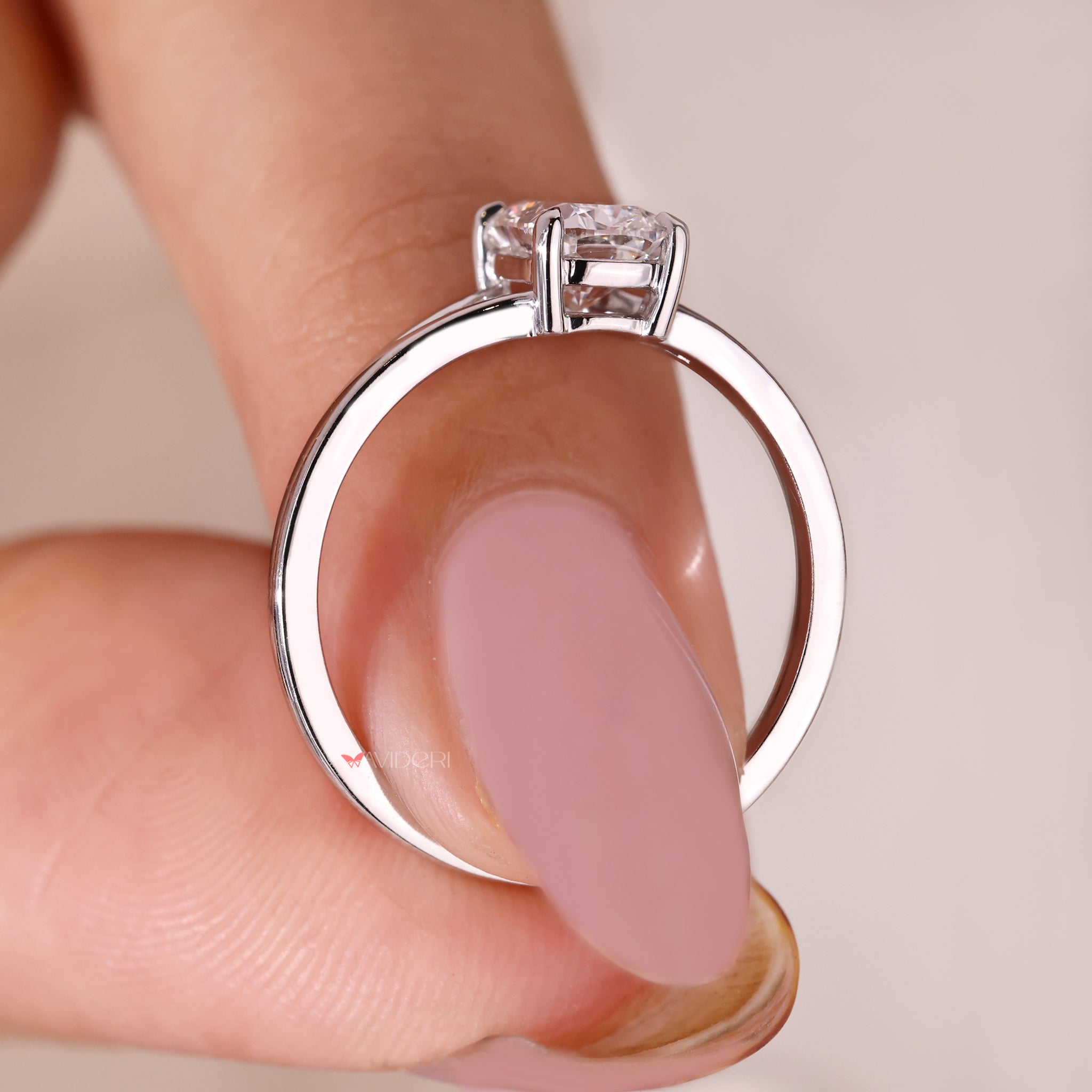 White gold ring with a beautiful cushion cut diamond center.