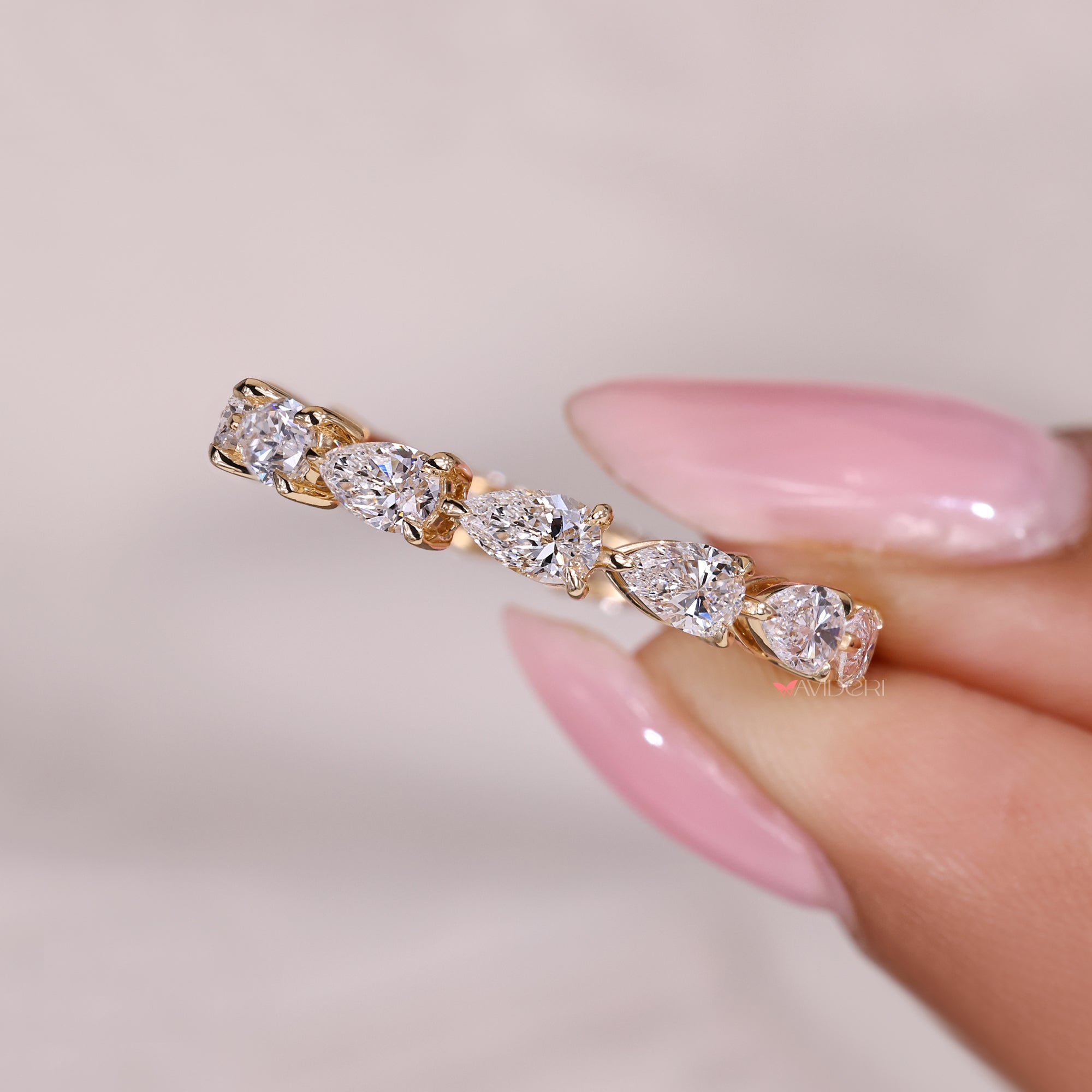 Lab grown diamond full eternity band with pear cut stones.
