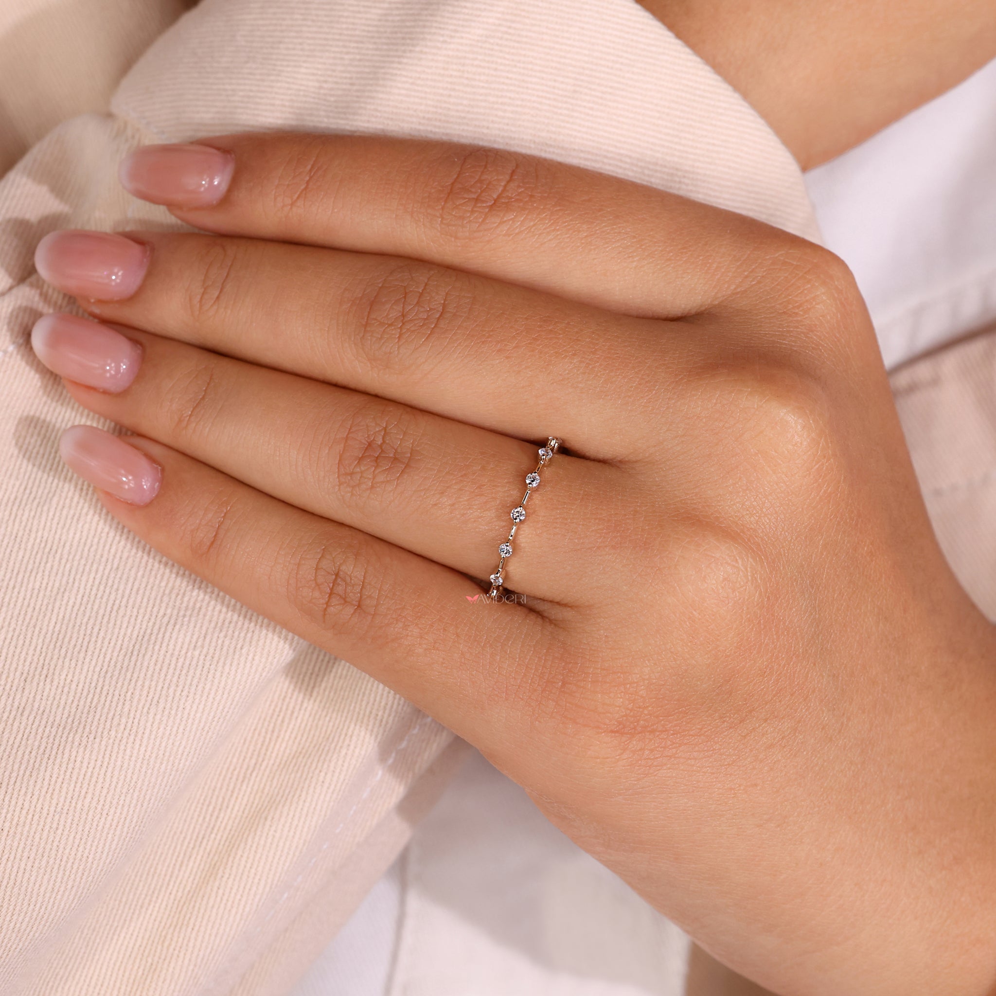 Distance pave band with a classic eternity wedding band design.
