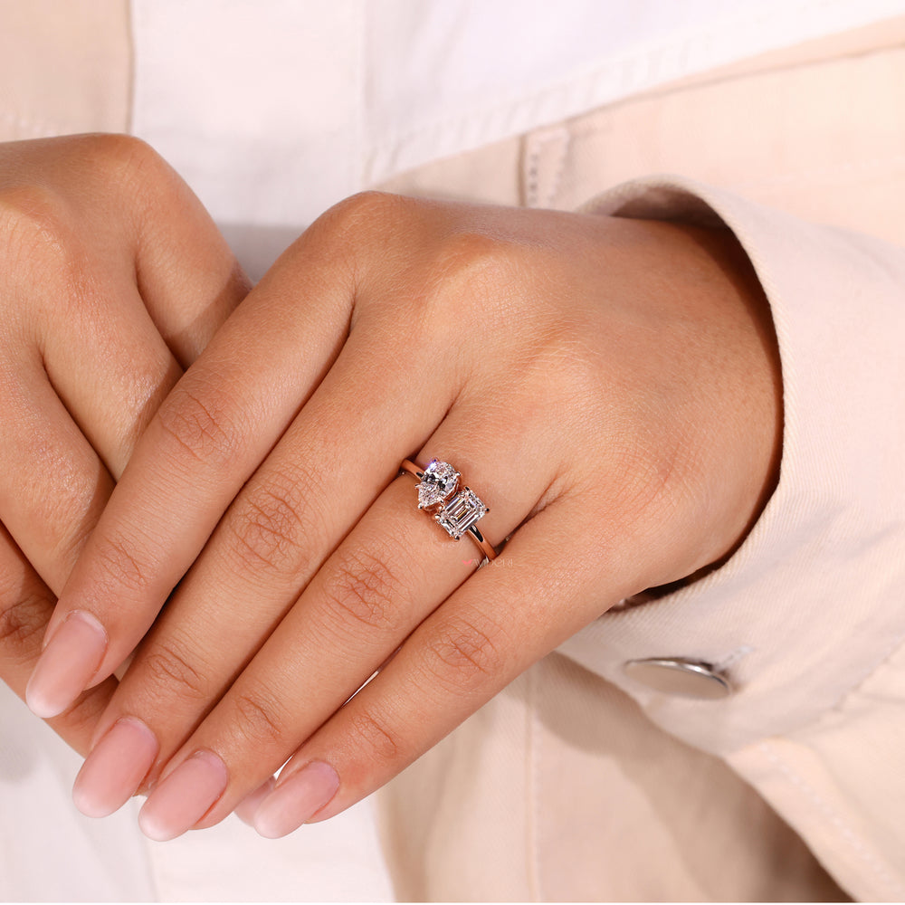 Classic emerald and pear cut engagement ring showcasing a dazzling centrepiece for special moments.