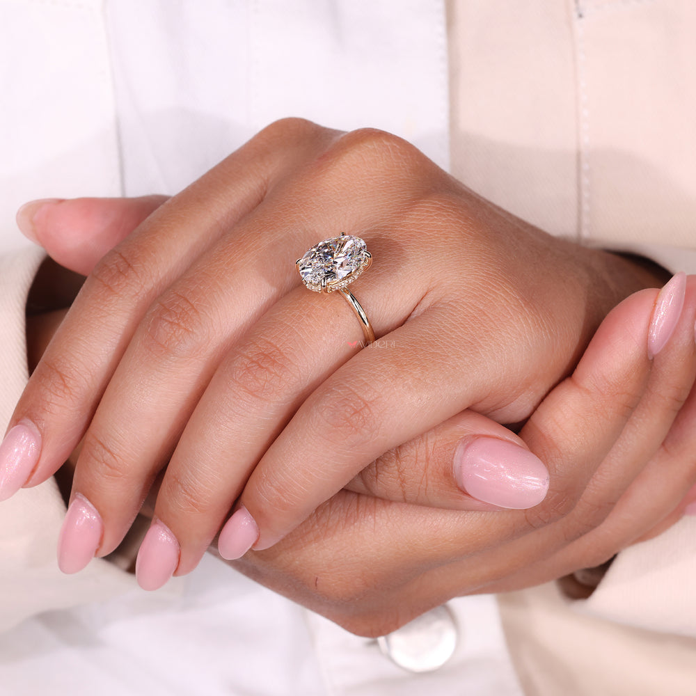 Hidden Halo Ring with an oval cut diamond, enhancing the beauty of the center stone