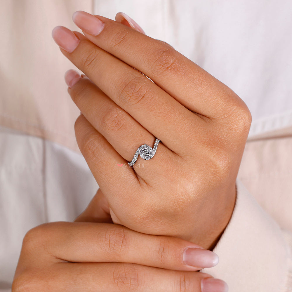 Modern bypass ring with a unique and contemporary design.
