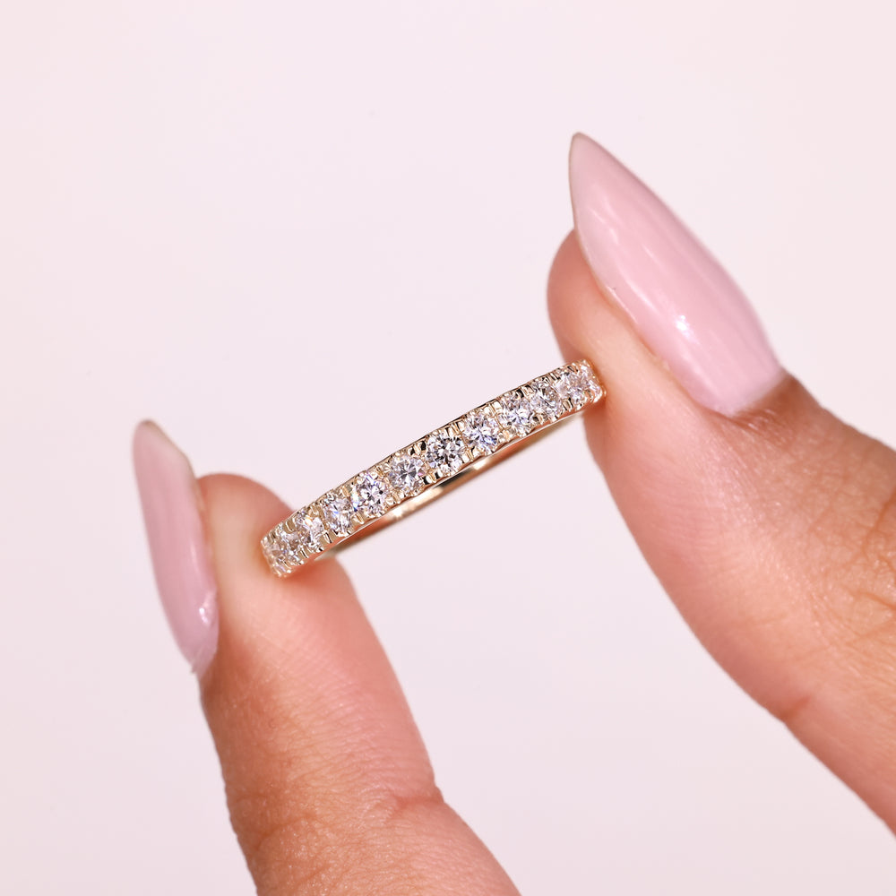 Minimal round diamond half eternity ring.
