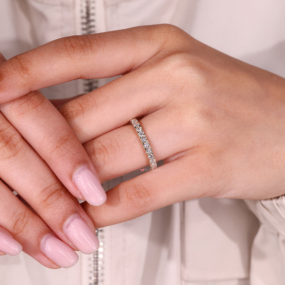Prong set round diamond half eternity band.
