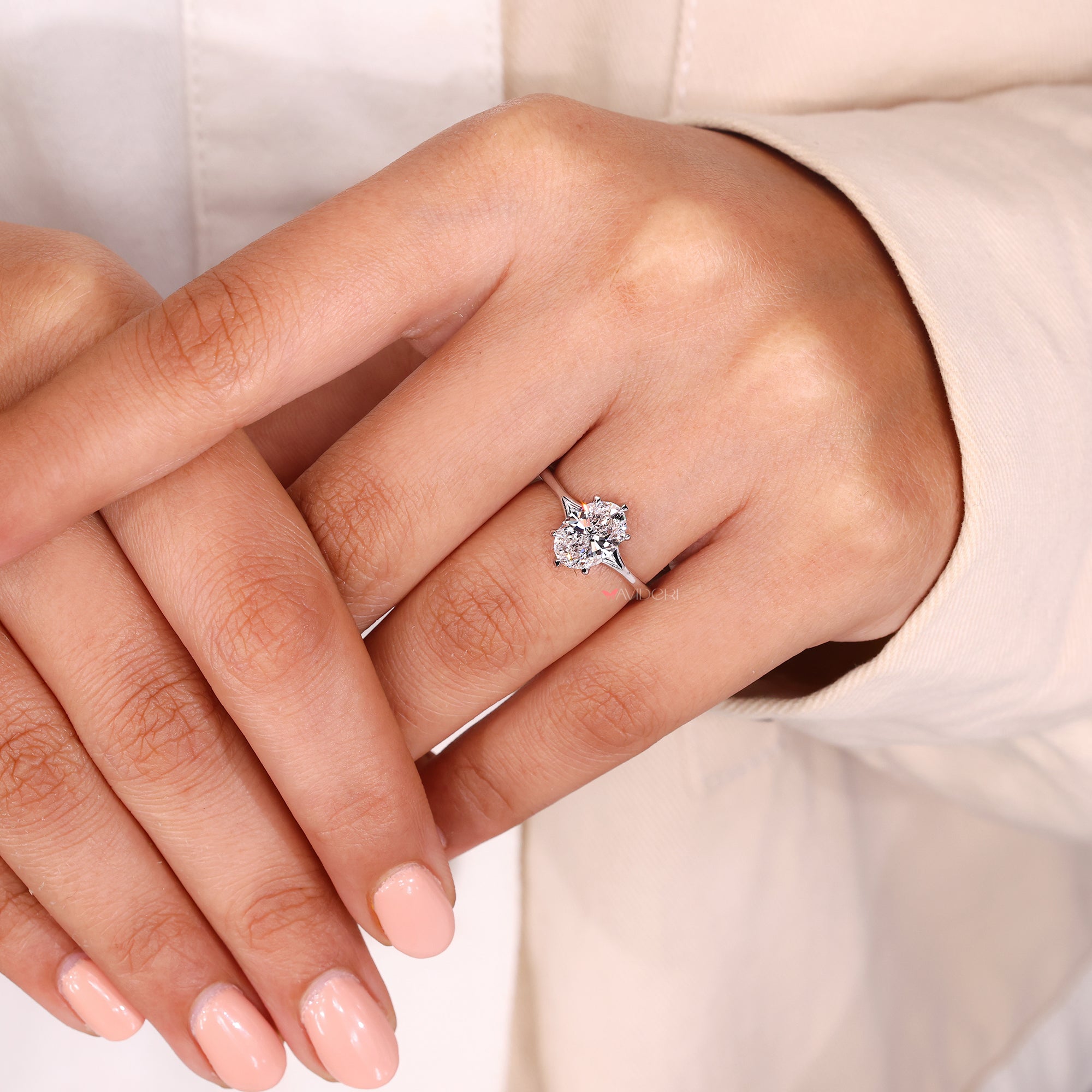 Custom oval engagement ring with handmade split shank band.