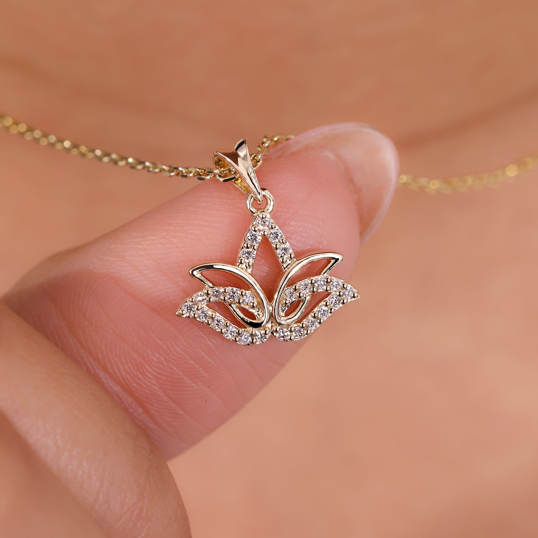 This lotus pendant offers a unique and elegant design.