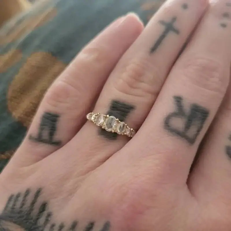 Wow. All around amazing experience. I placed my order prematurely before looking at all of the pieces, and Jay was super kind to switch to a different piece and customize it for me. This is actually the 7 oval and round stone ring made with moissanite. I never had an engagement ring. My dream ring was unobtainable, and I didn't want to settle for something I didn't really love. I was good with it. My jaw dropped when I found this shop. This is the EXACT same ring I fell in love with at a high end Brooklyn boutique, but THIS ring was 100% obtainable. Bananas. Shipping was very fast, and Jay even sent a photo of the finished piece beforehand. Very kind, very professional. Blown away. Thank you for your beautiful work!