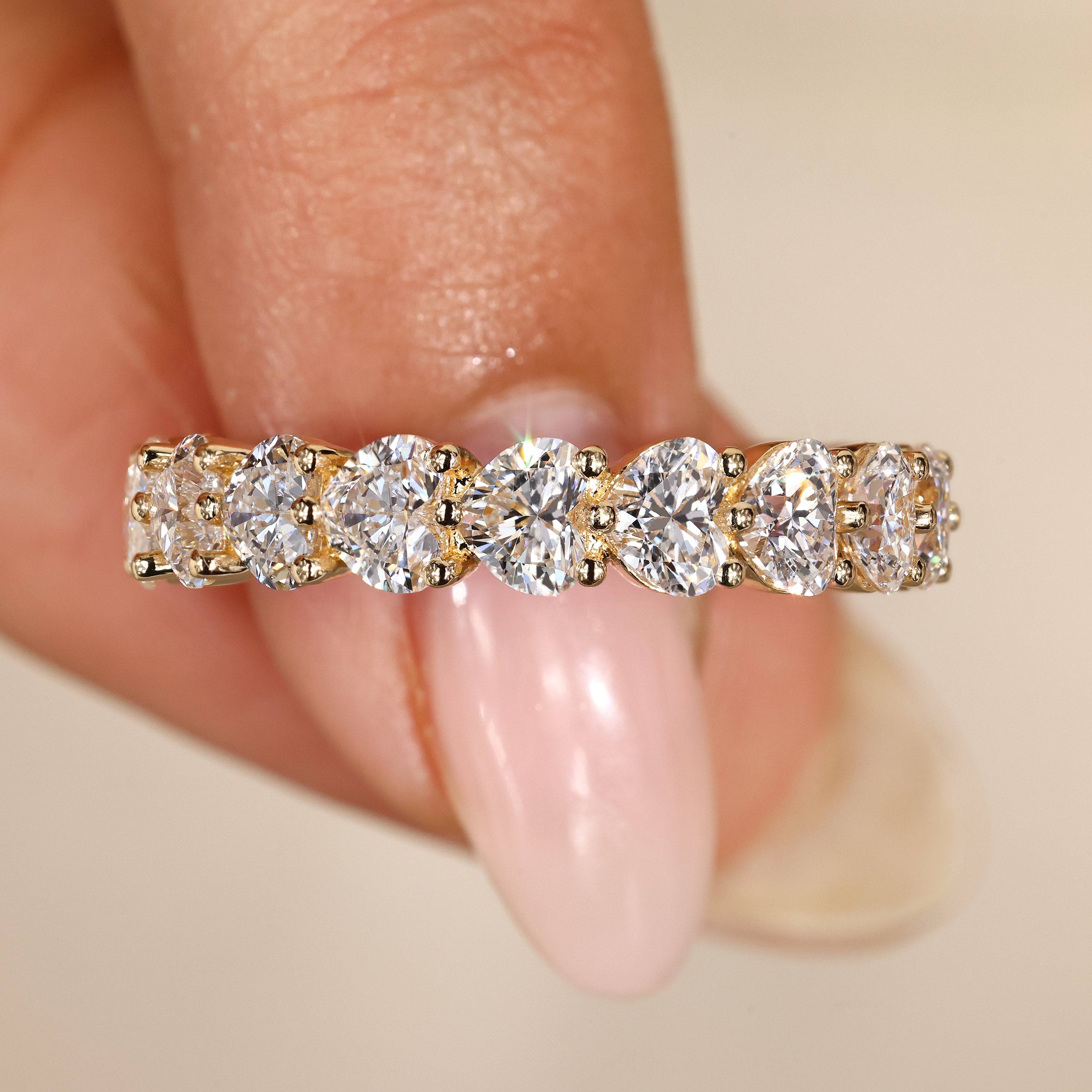 Lab grown heart diamond band with shared prongs.
