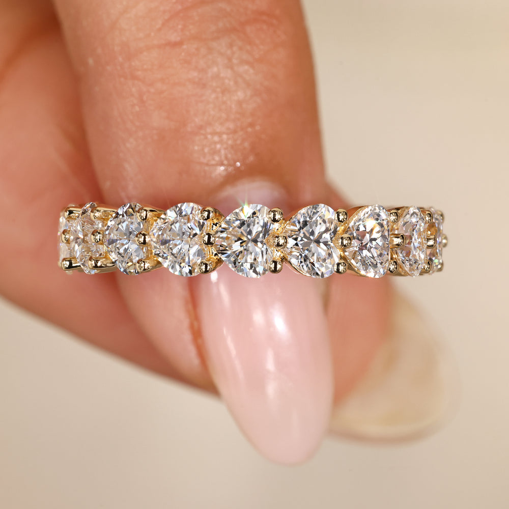 Lab grown heart diamond band with shared prongs.
