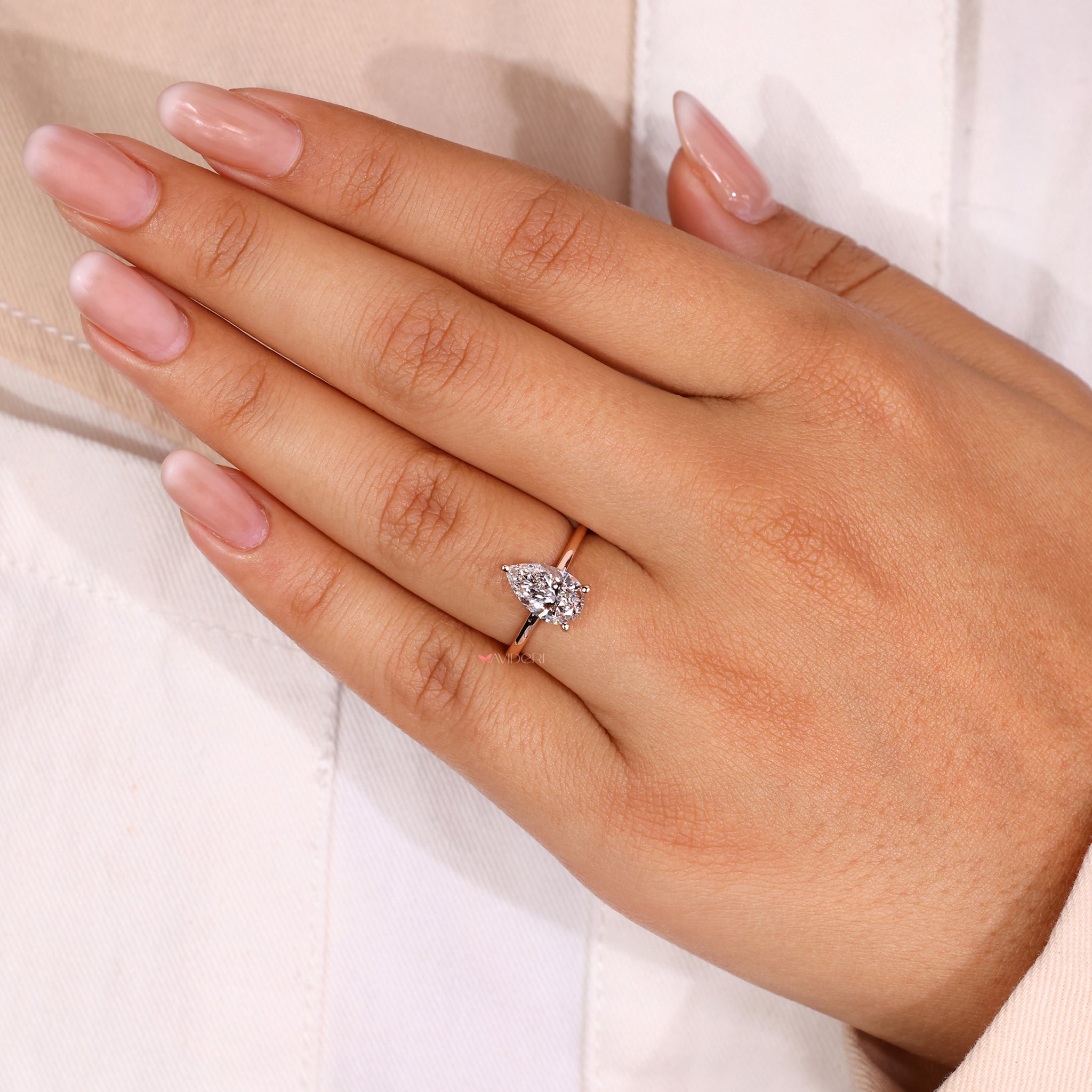 Beautiful pear shaped diamond ring showcasing elegance and charm.
