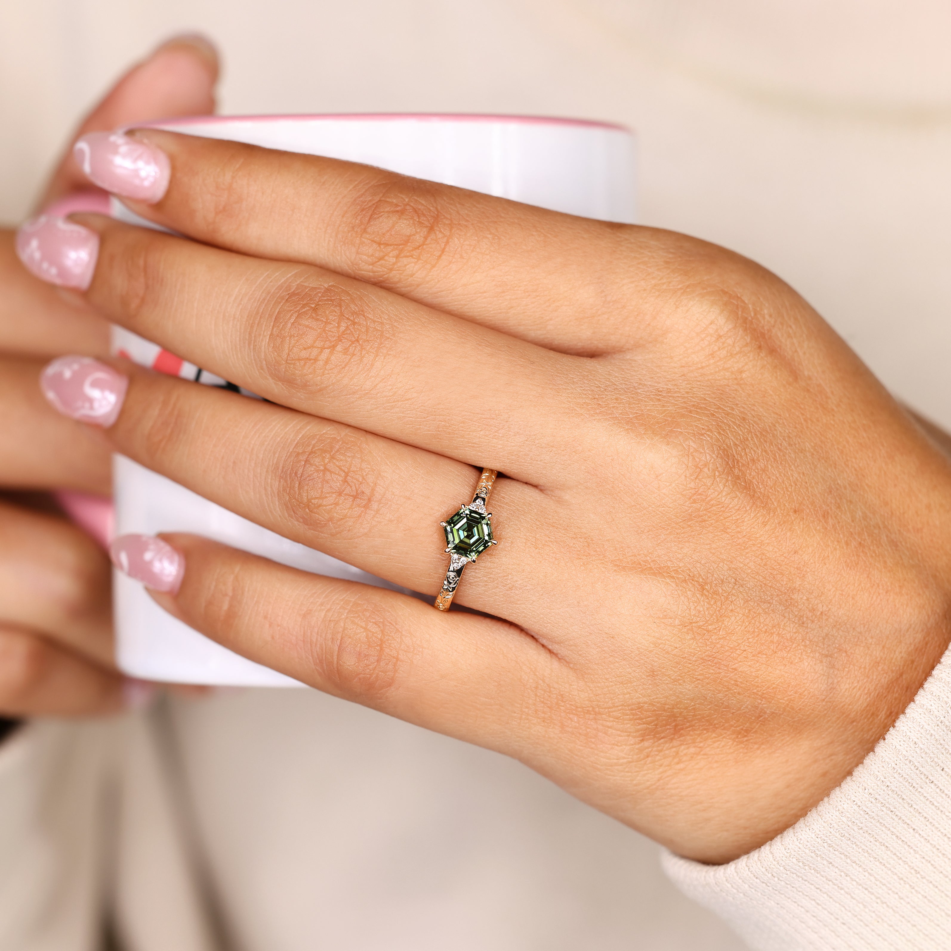 Green diamond engagement ring with Muse setting.
