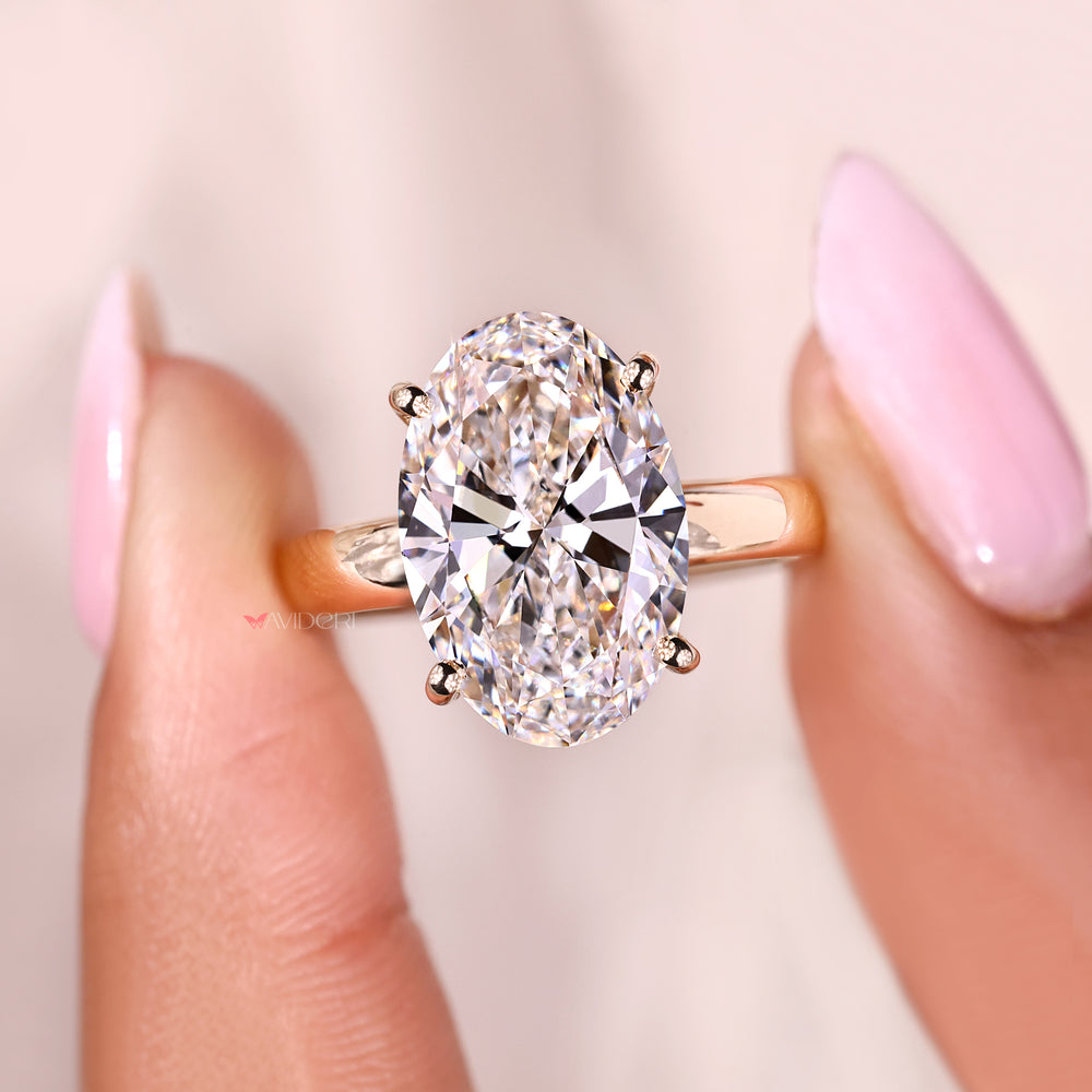 Luxury oval cut diamond ring with hidden halo style.
