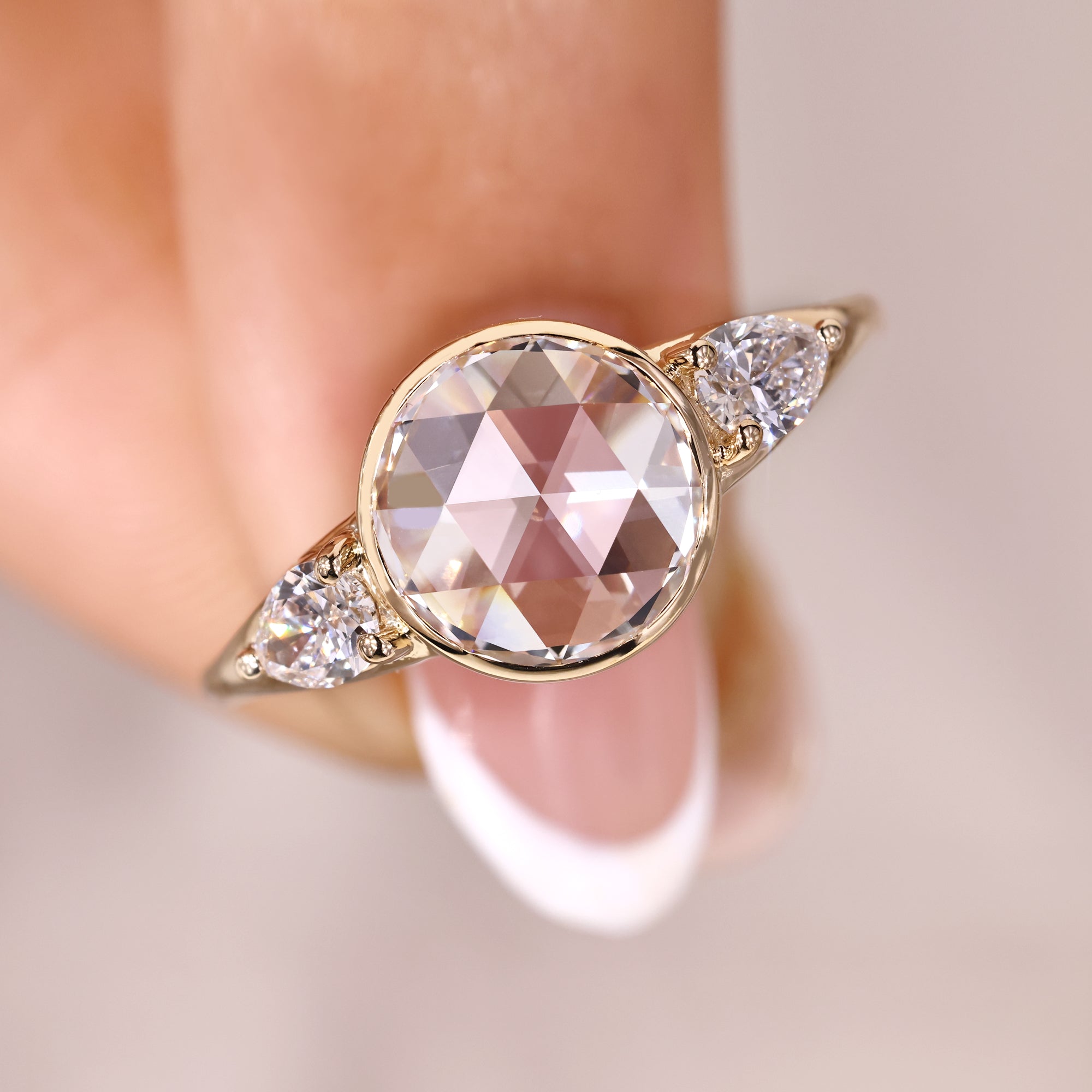 Lab-grown ring in three stone bezel ring.