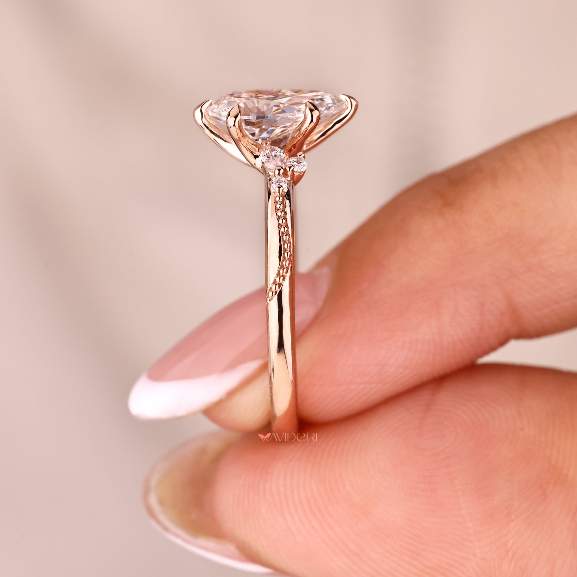 Milgrain setting engagement ring with six claw prong.