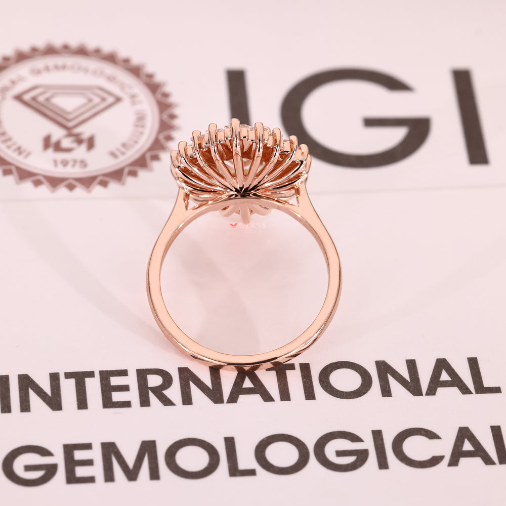 Cathedral setting pear cut diamond ring with baguette sides.