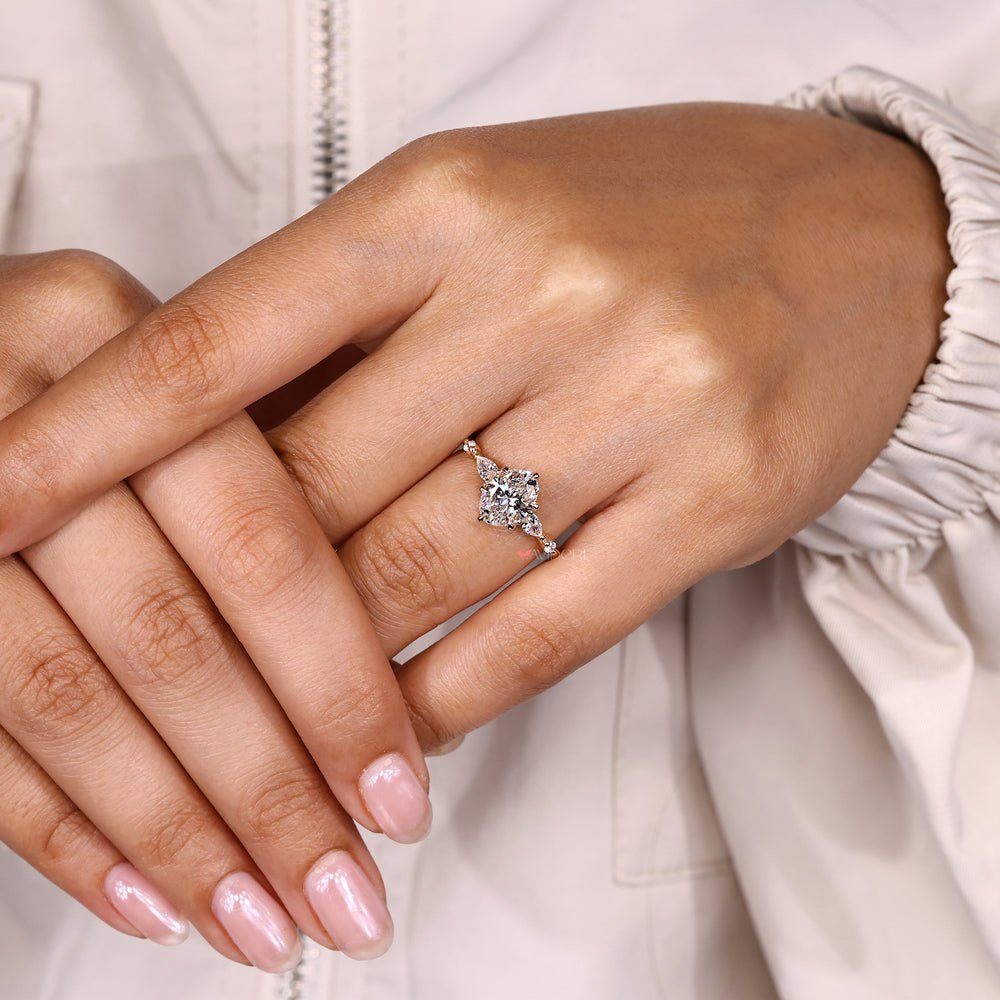 Oval ring with tulip basket and side stones.
