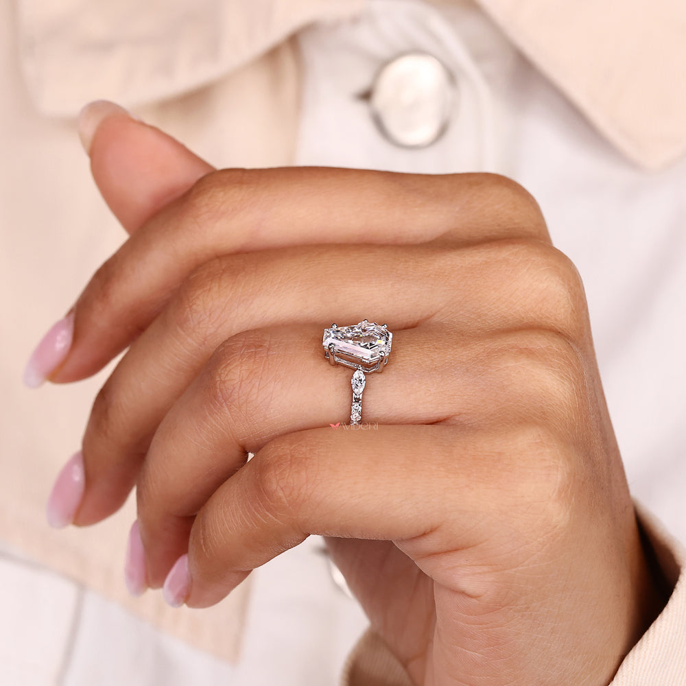 IGI certified coffin cut diamond ring with side stones.
