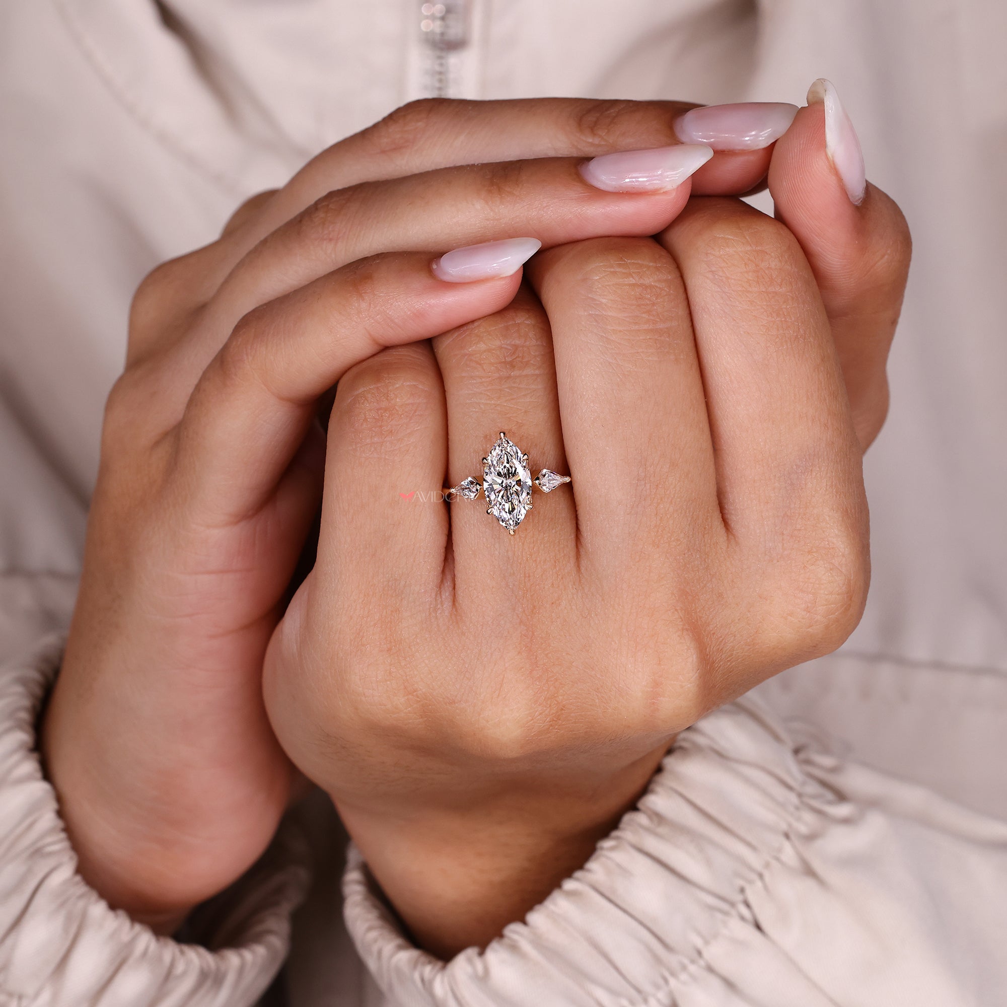 Marquise diamond ring with six claw prong setting.