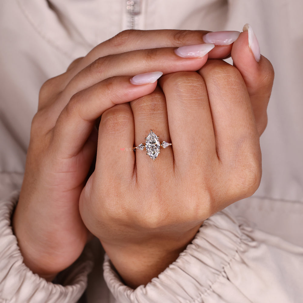 Marquise diamond ring with six claw prong setting.