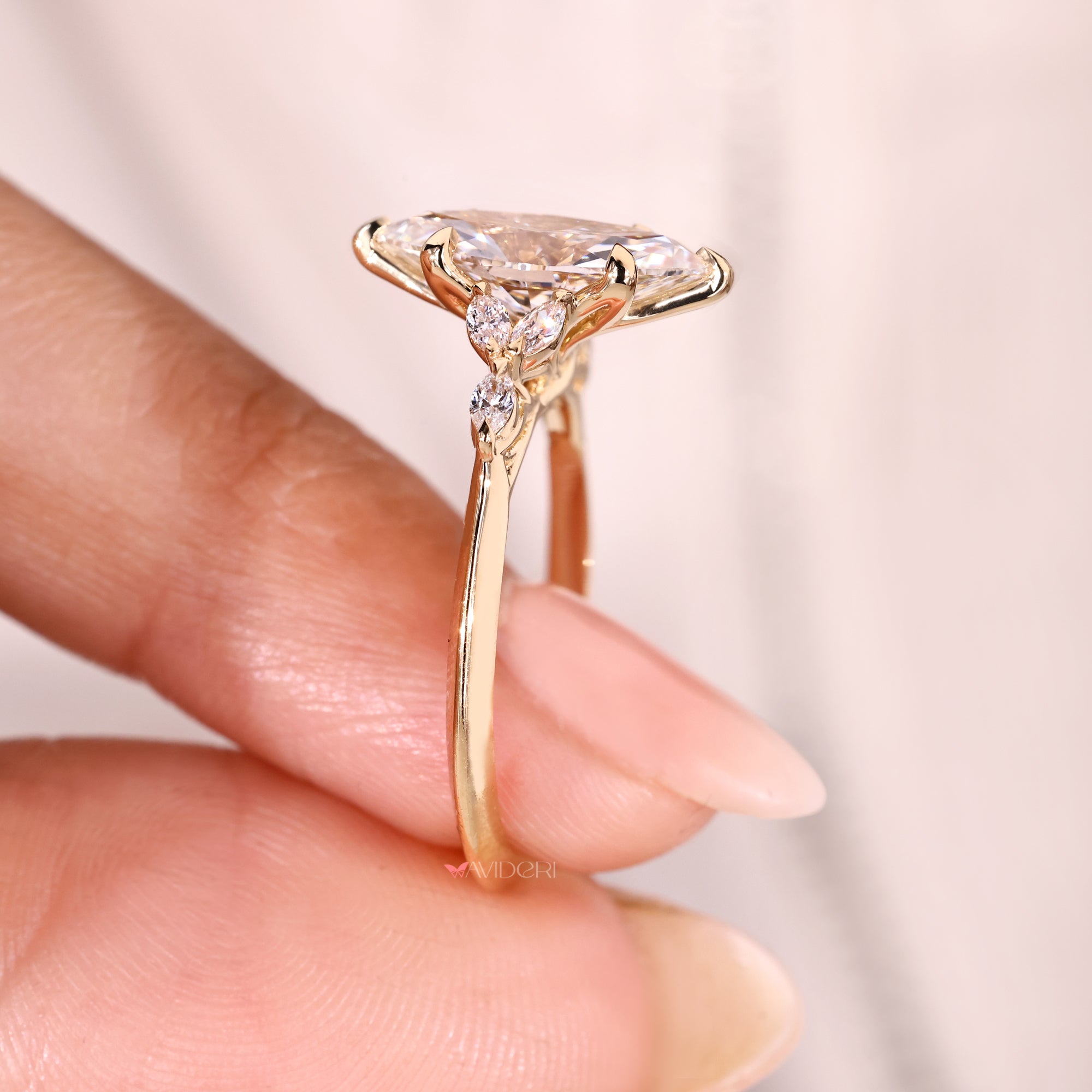 Lab grown marquise diamond ring with six prongs.

