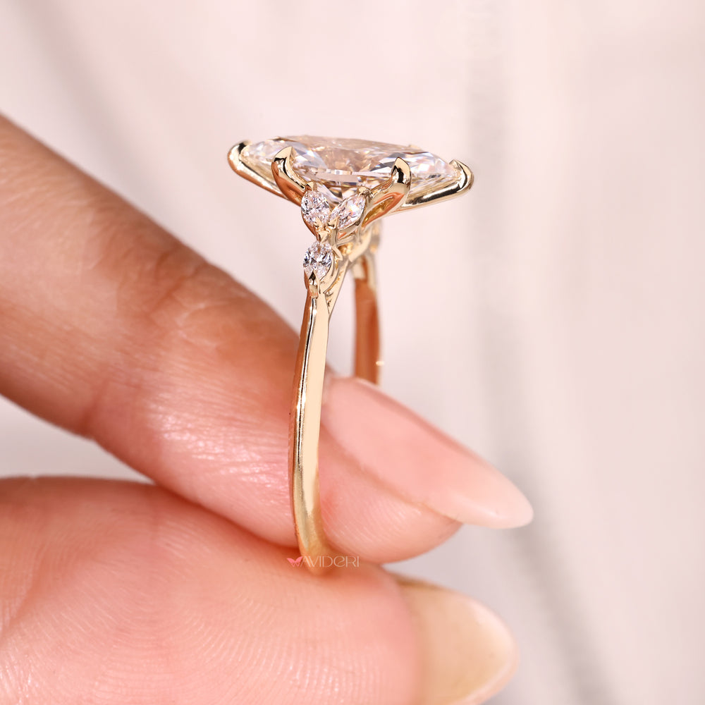 Lab grown marquise diamond ring with six prongs.
