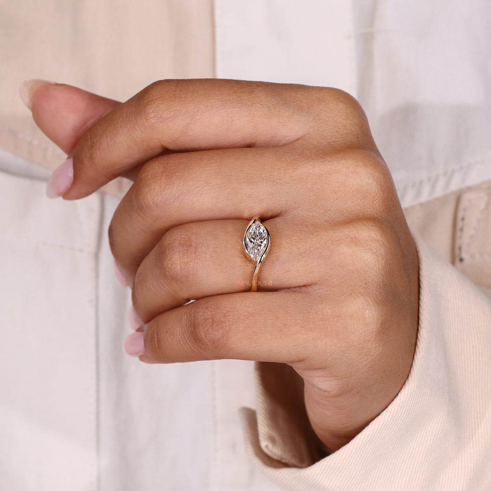 Marquise diamond ring solitaire bypass style.
