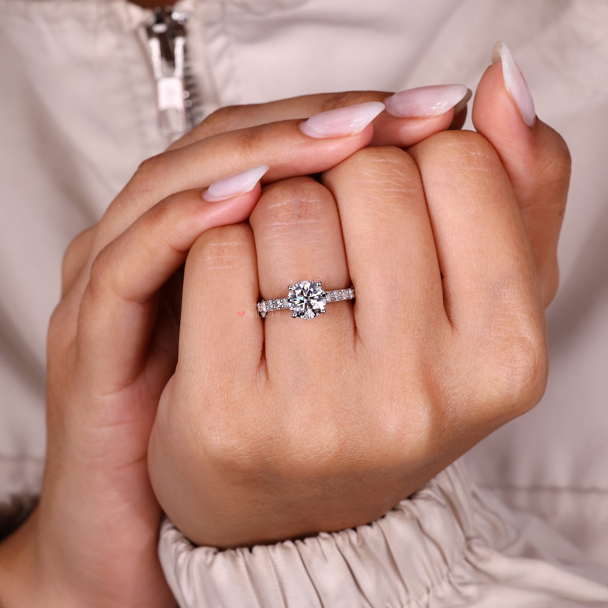 Round diamond ring with four prong setting.
