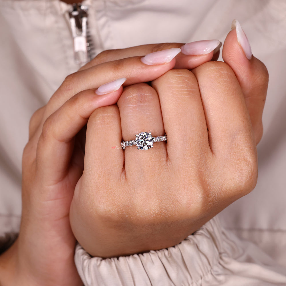 Round diamond ring with four prong setting.
