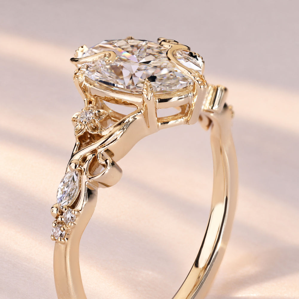 Nature inspired oval diamond ring with twisted vine.
