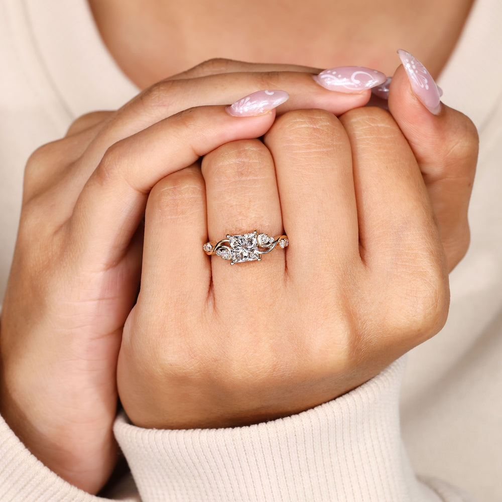 Princess cut diamond ring with prong basket setting.

