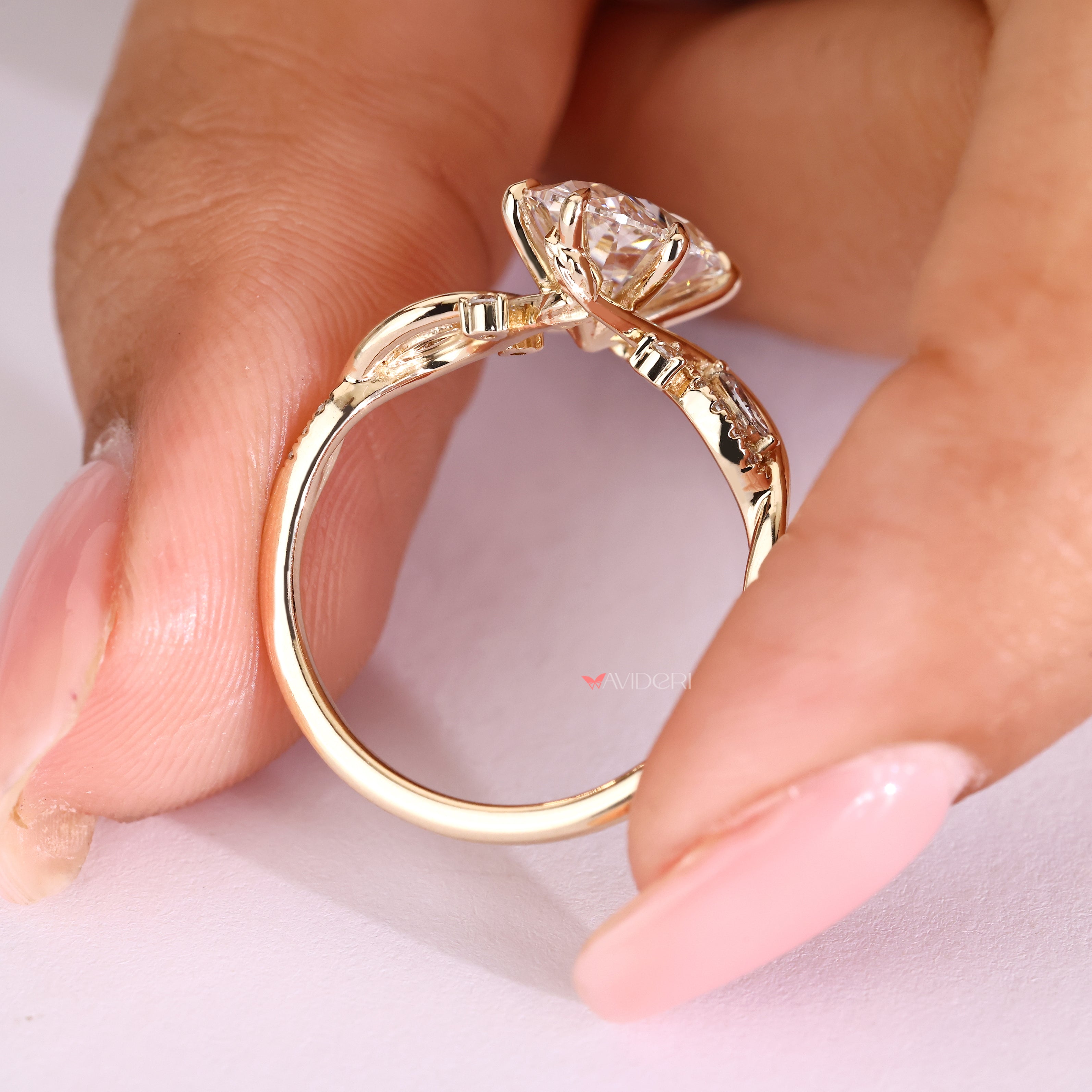 Oval diamond ring with pavé setting and six claw prongs
