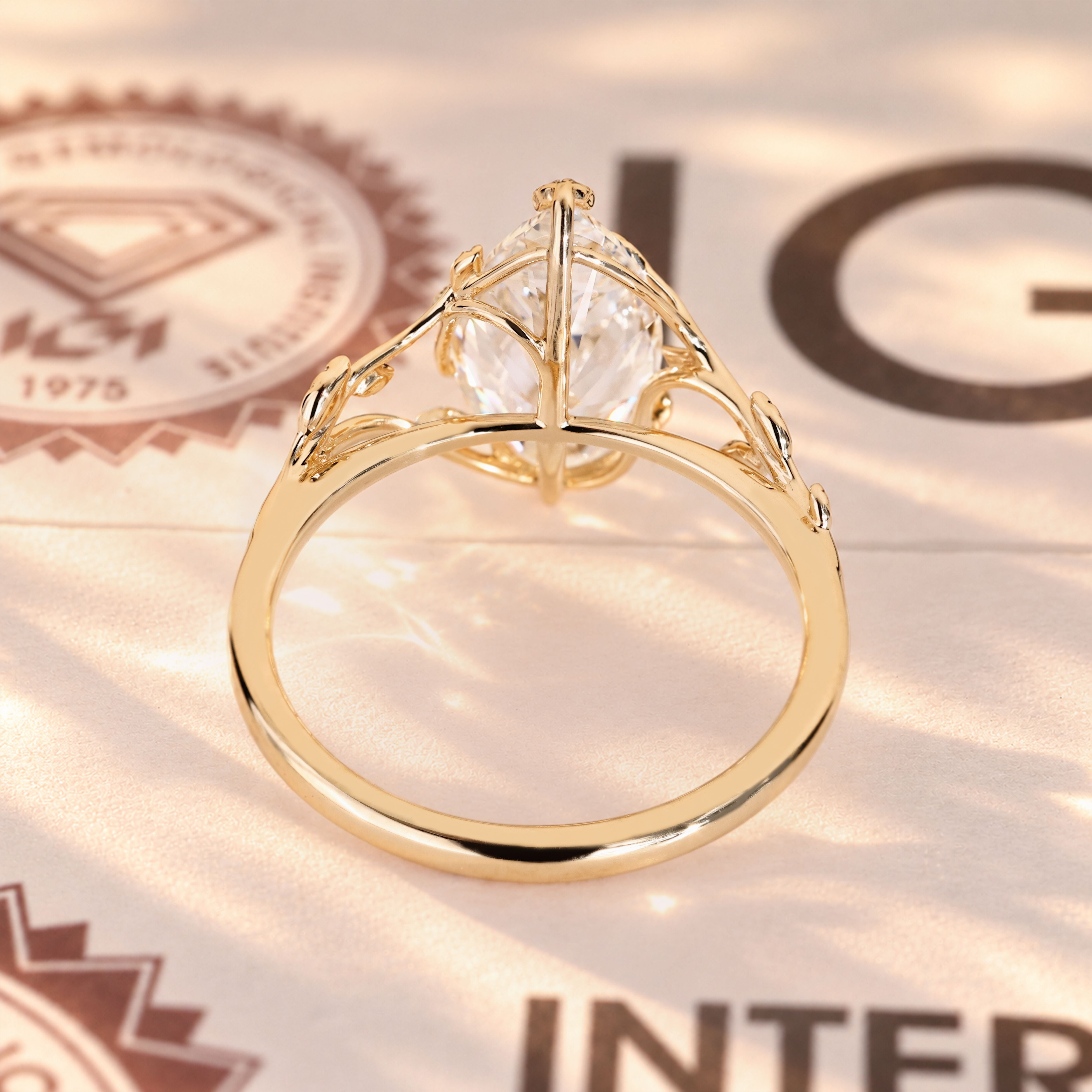 Marquise diamond ring with delicate leaf prongs.
