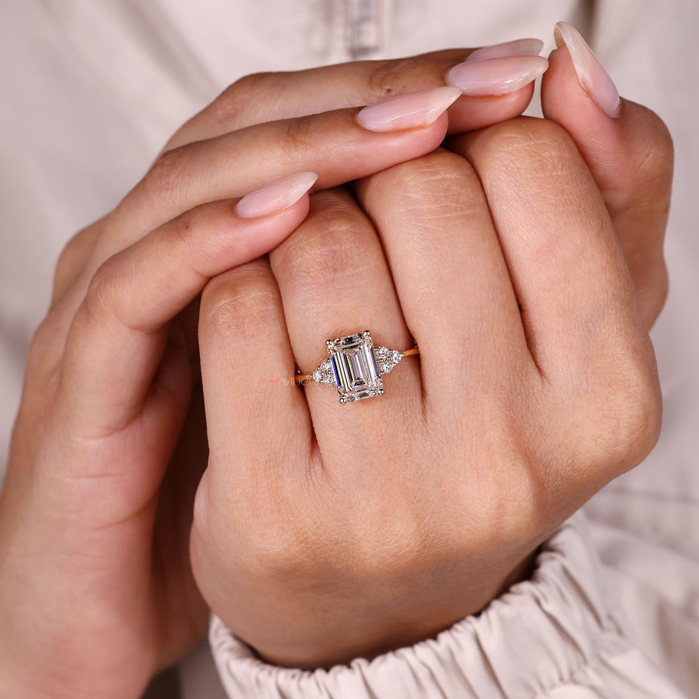 Four prong emerald cut diamond ring.
