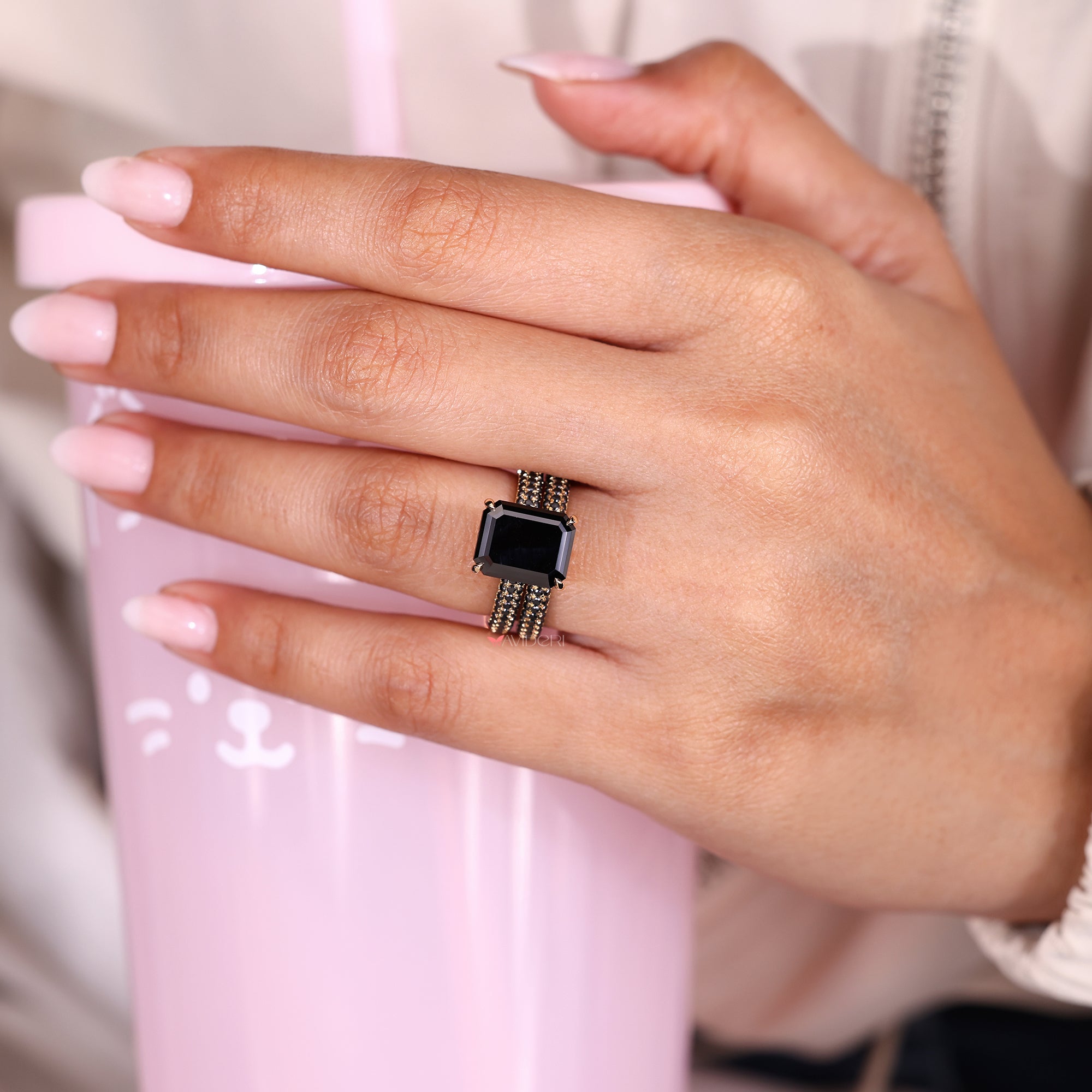 Black moissanite ring set in an elegant emerald cut moissanite ring.