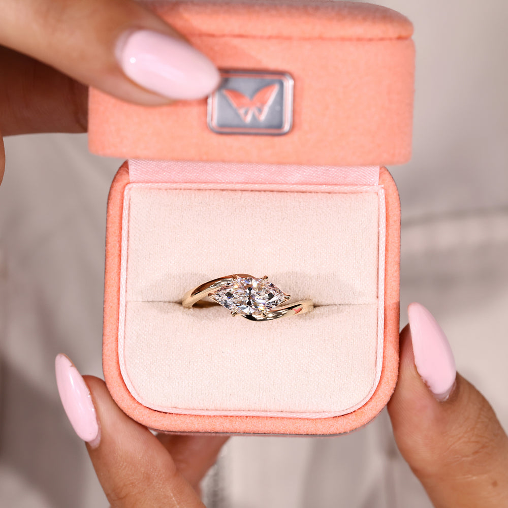 East to west marquise diamond ring with solitaire style
