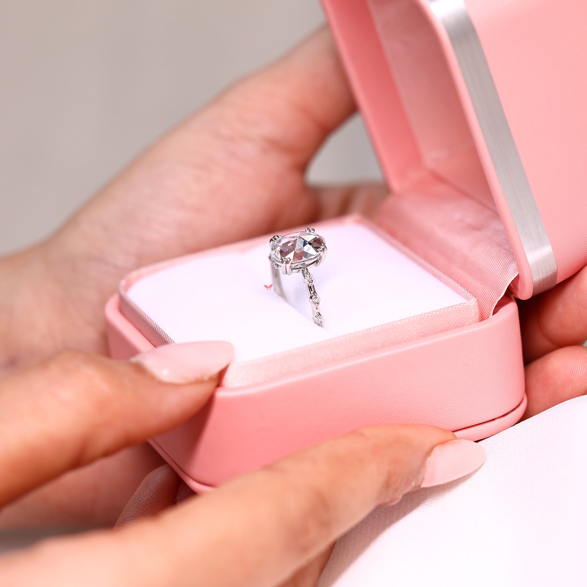 White gold diamond ring with oval rose cut engagement ring.