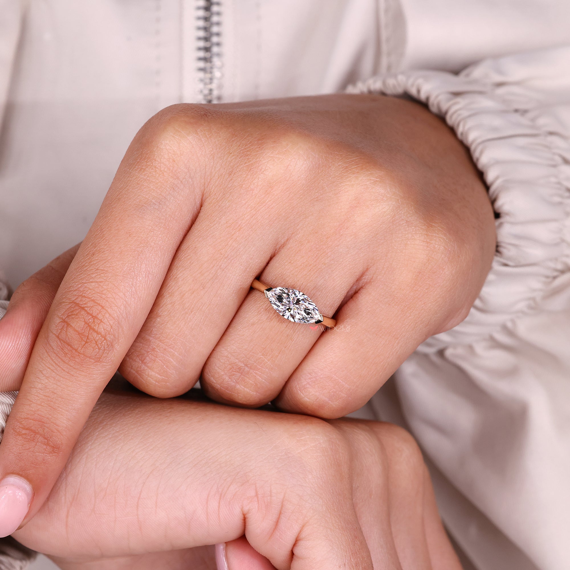 V prong setting with yellow gold engagement ring.