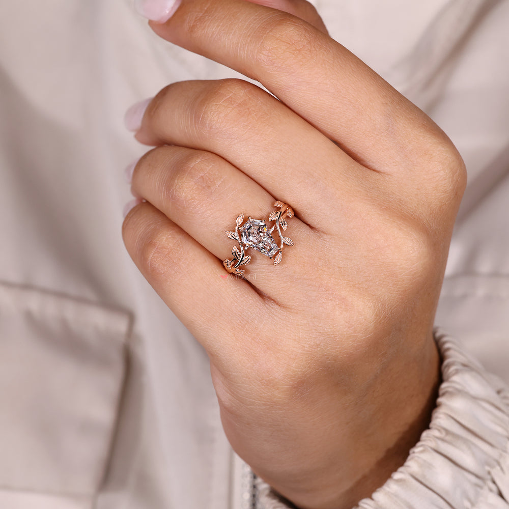 Coffin cut diamond ring with refined prong setting.
