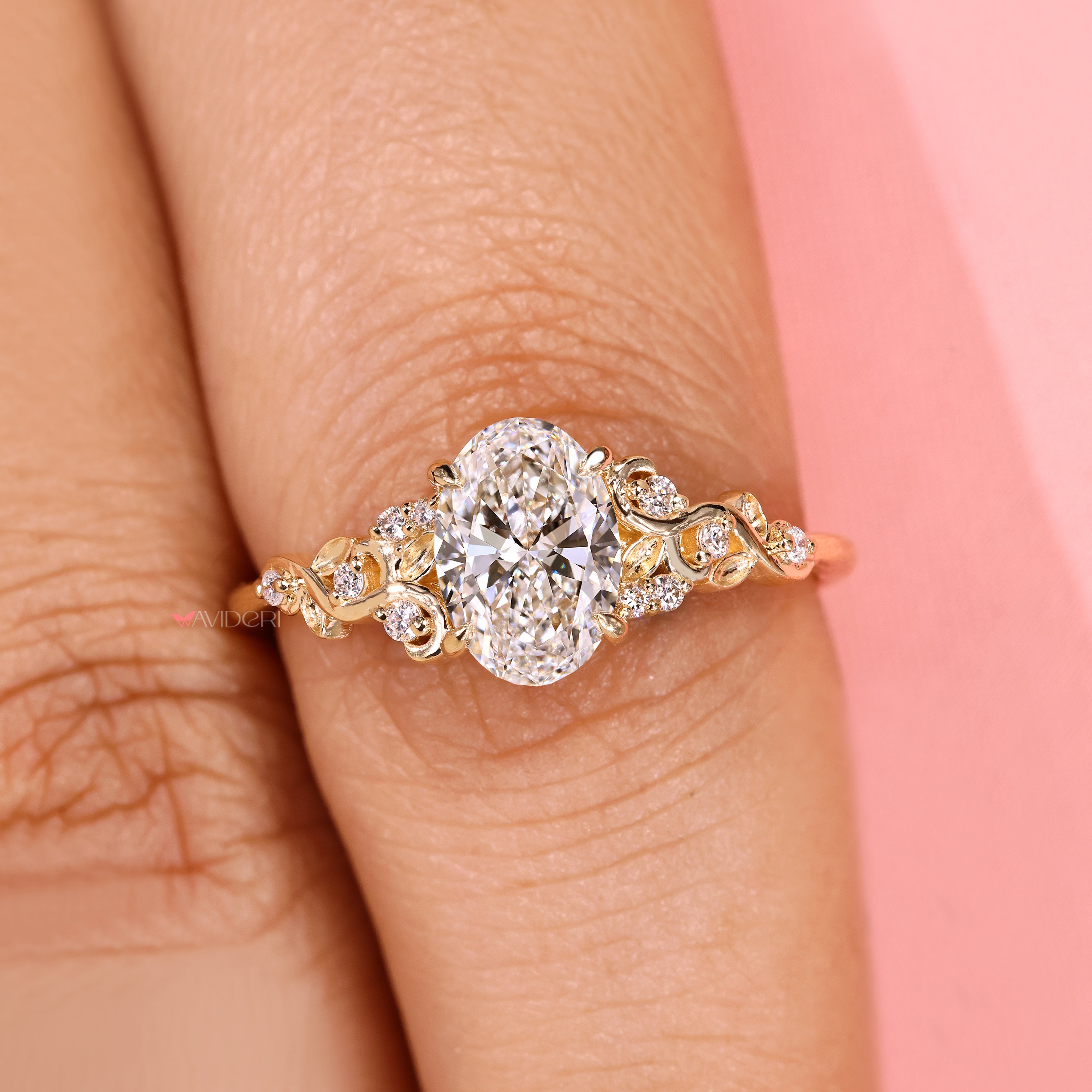 Oval cut ring with round side stone accents.
