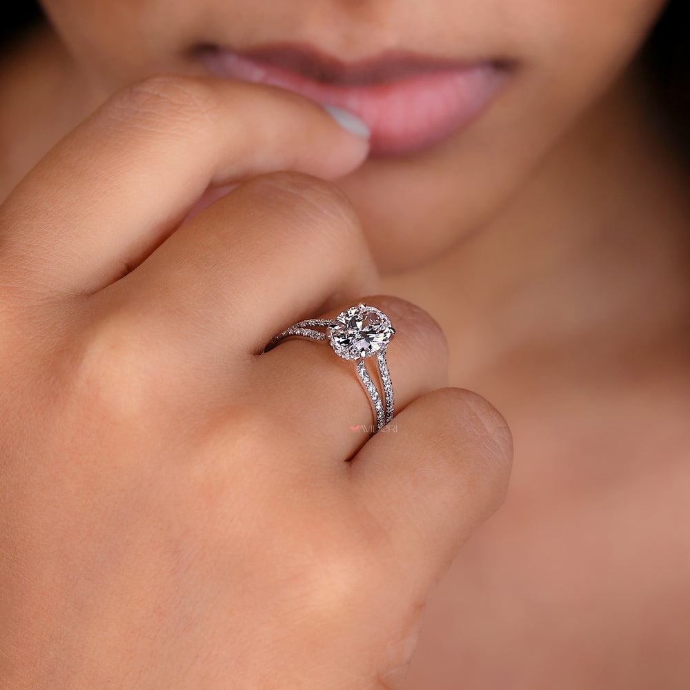 Lab grown oval cut diamond ring with four prong setting.