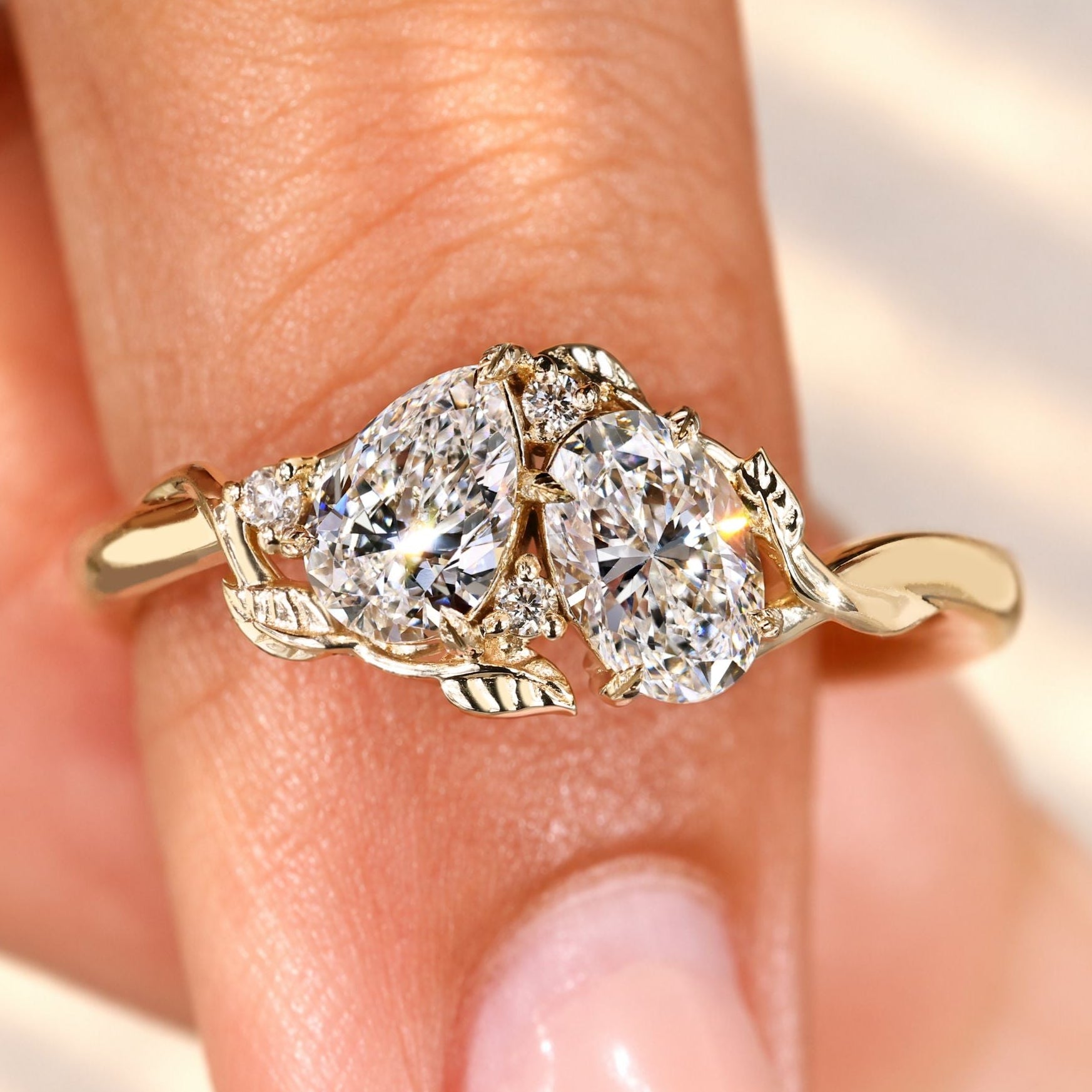 Toi et moi ring with pear and oval diamonds.
