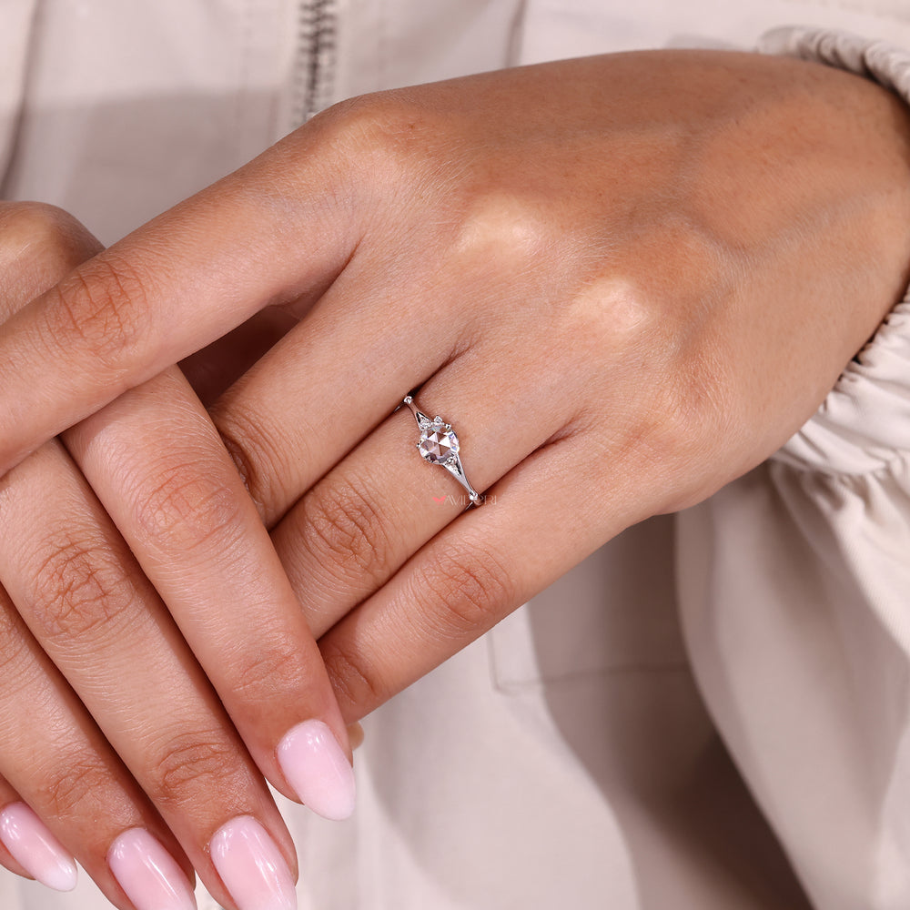 Rose cut center diamond ring with split shank.
