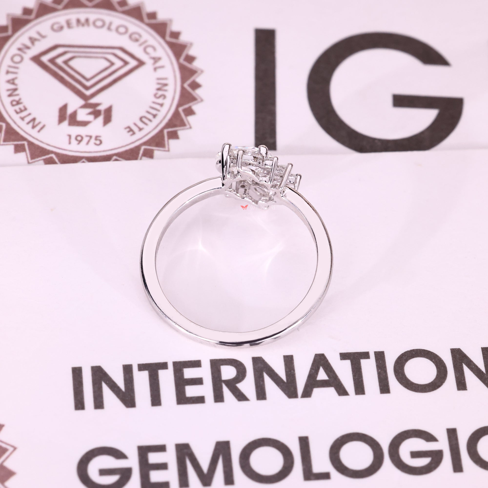 Handmade oval cut diamond ring with halo detail.
